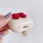Beige Red Bow Shell Pendant Wireless Earphone Case - Image 4