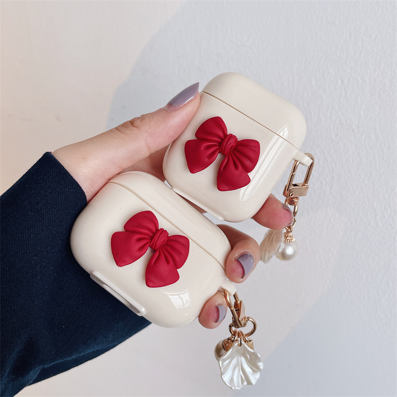 362eb976-e479-4023-9fb4-b5d2100cd259.jpg Beige Red Bow Shell Pendant Wireless Earphone Case - Image 1